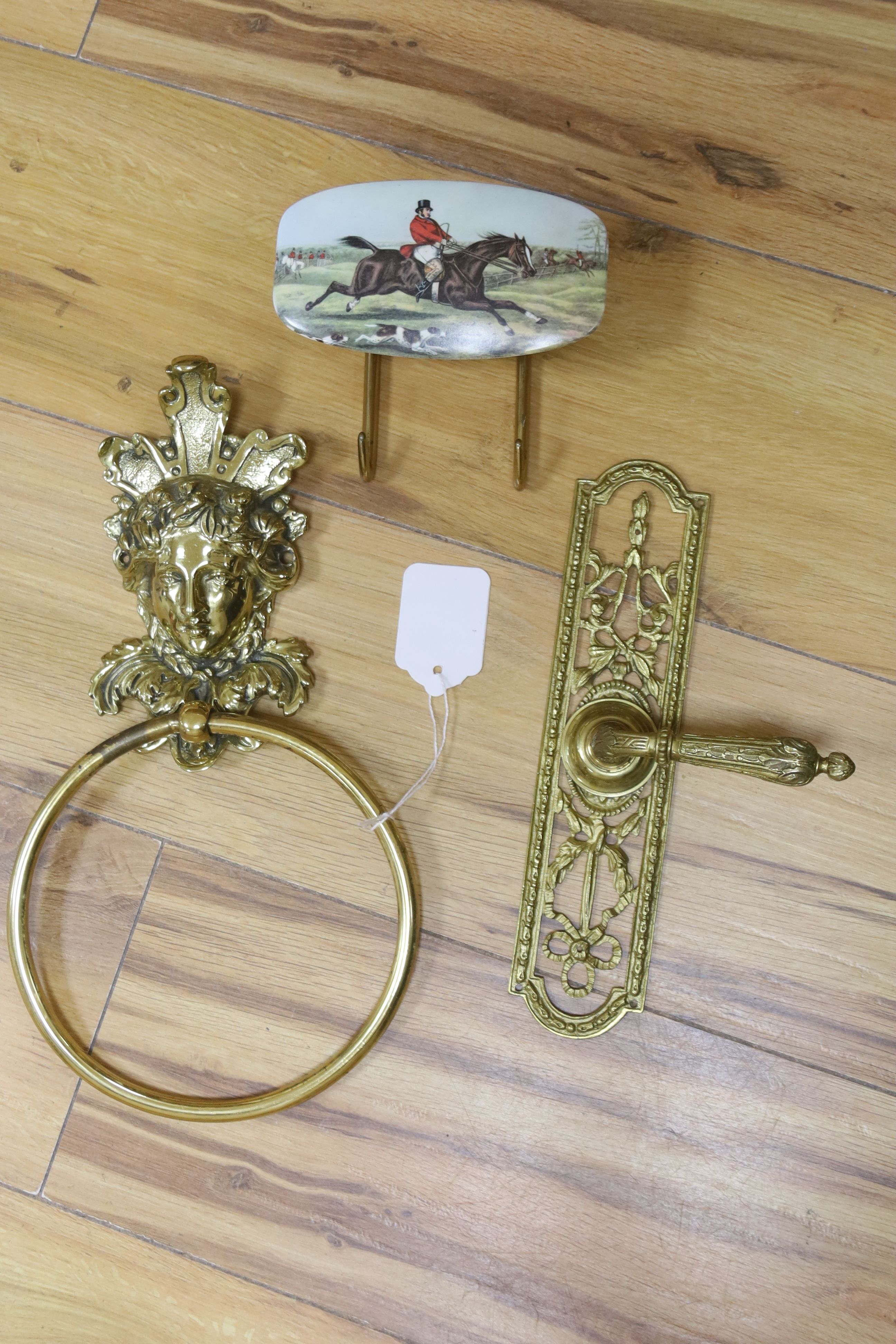 Various door fittings including three brass mask door knockers